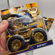 HOT WHEELS MONSTER TRUCKS TROPHY CHAMPIONS GOLD SERIES LOT OF 4 BIG FOOT SNEAKER