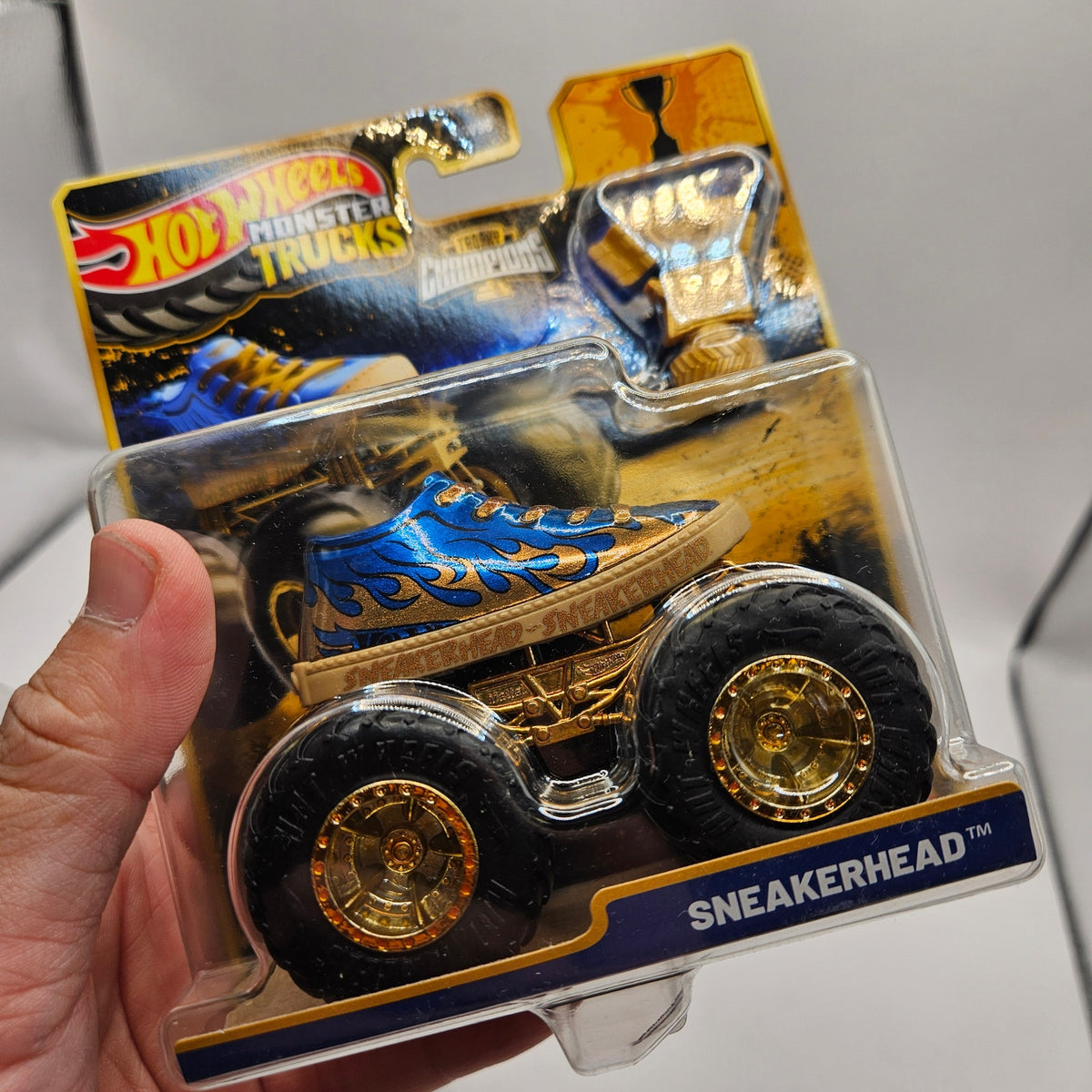 HOT WHEELS MONSTER TRUCKS TROPHY CHAMPIONS GOLD SERIES LOT OF 4 BIG FOOT SNEAKER