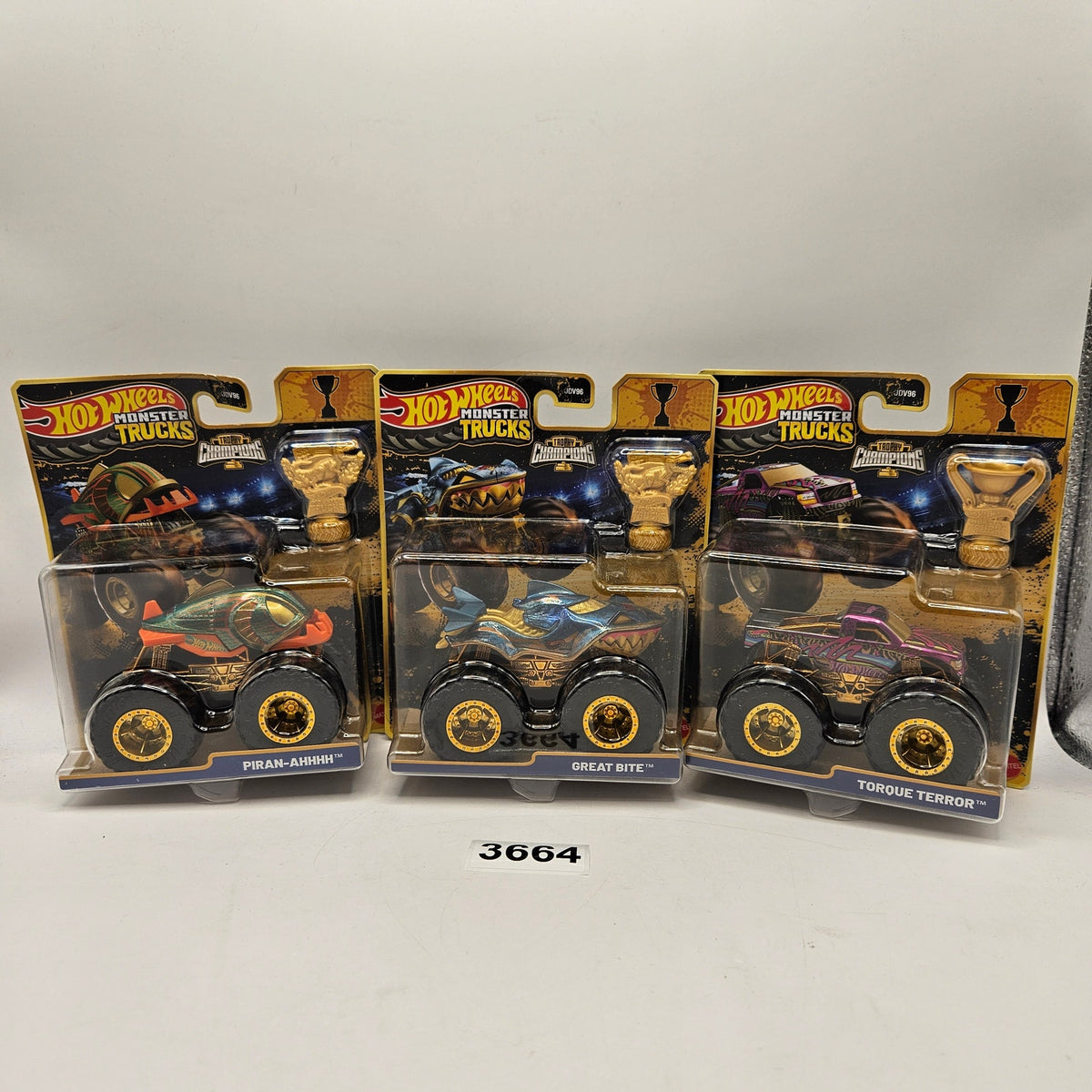 HOT WHEEL MONSTER TRUCKS TROPHY CHAMPION GOLD SERIES LOT OF 3 PIRAN BITE TORQUE