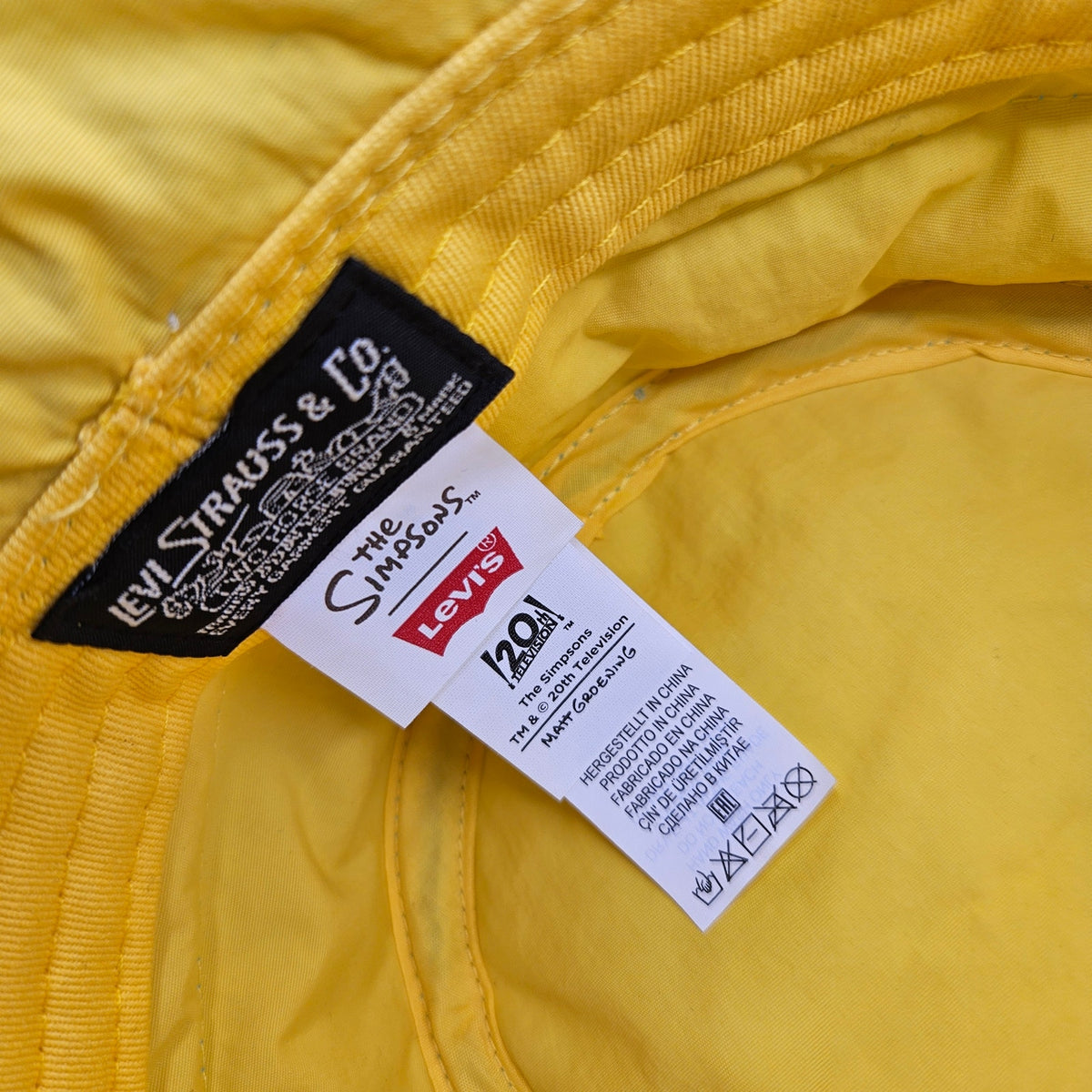 LEVI'S X SIMPSONS UNISEX MEDIUM CLOUD PRINT PUFFY BUCKET HAT BLUE YELLOW NWT